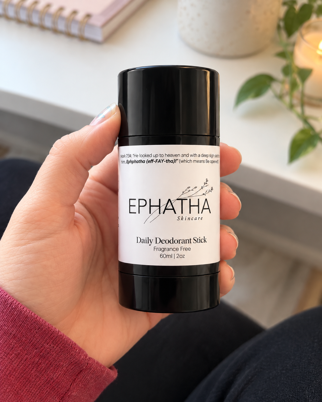 Ephatha Daily Deodorant Stick 2 oz shown in hand for scale