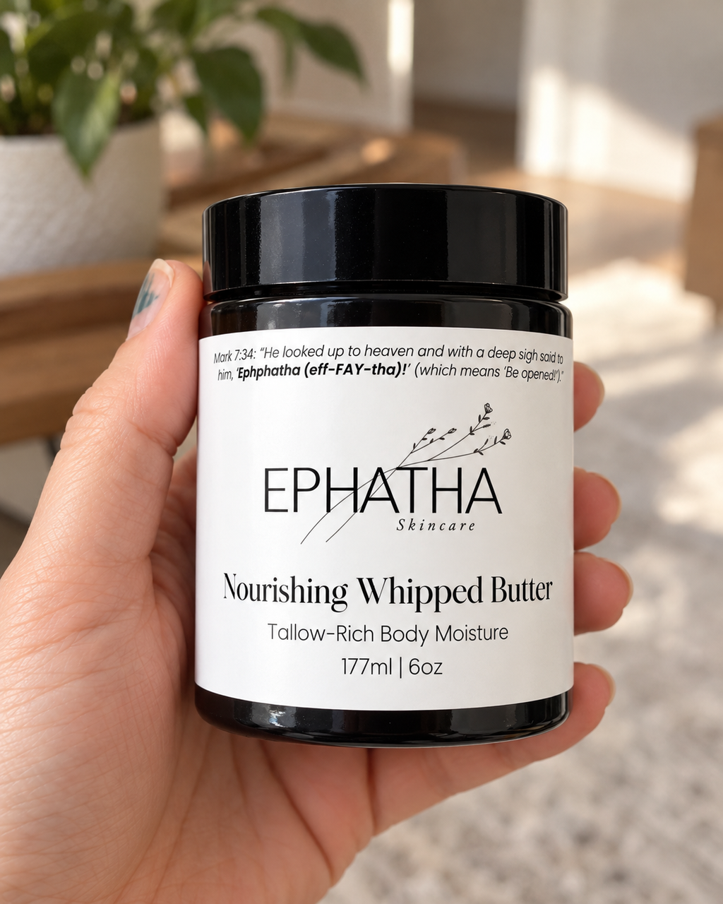 Ephatha Nourishing Whipped Butter 6 oz jar shown in hand for scale